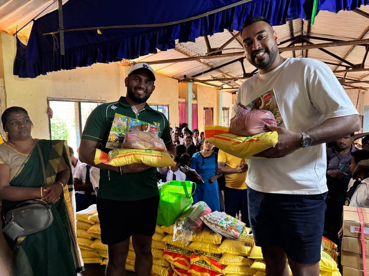 Rice, books and supplies being distributed at a school hall in the Nuwara Eliya district